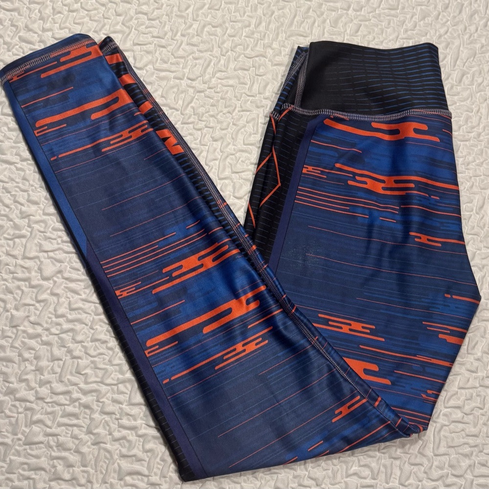 Leggings with a blue and orange print. One size fits most.